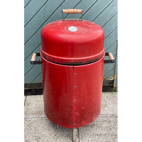 4 - A child's pine garden table, 90cm diameter with six matching pine stools and a drum BBQ.