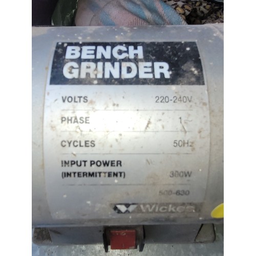 17 - A 240 volt bench saw, together with a Wickes 240 volt bench grinder. (2)