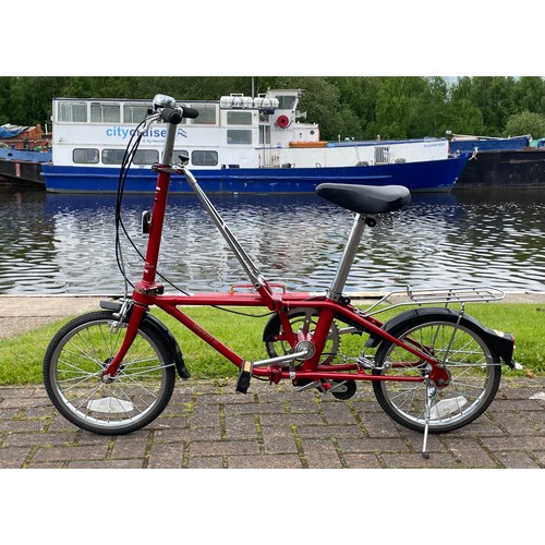 36 - A Dahon folding bicycle, metallic red with carry case.