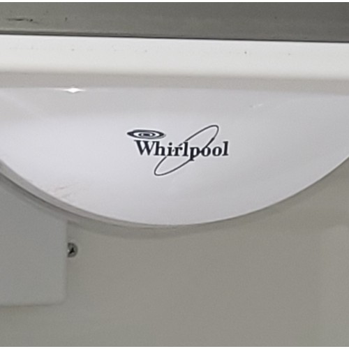 53 - A modern Whirlpool fridge/freezer, brushed stainless steel, having built in water dispenser and ice ... 