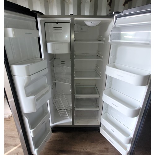 53 - A modern Whirlpool fridge/freezer, brushed stainless steel, having built in water dispenser and ice ... 