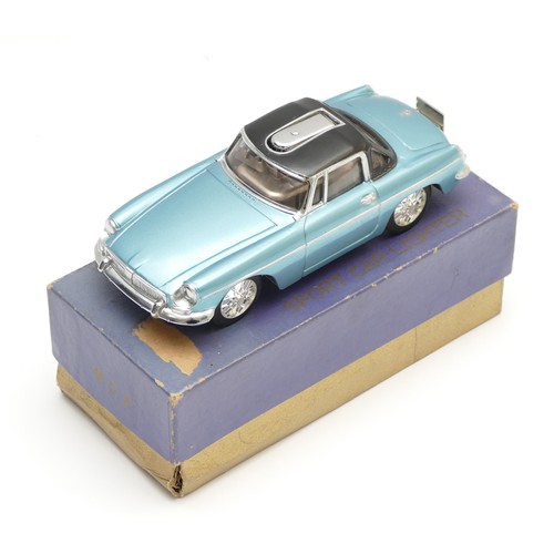 mg cigarette lighter A 1960s table lighter in the form of a MG sports car, made in Japan, the  painted metallic blue dieca
