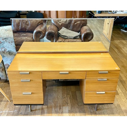 398 - A mid 20th century Stag teak dressing table, model S.322, mirror back over central drawer flanked by... 