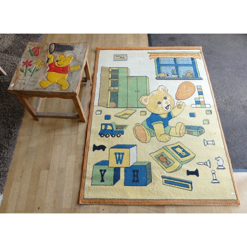 402 - A light oak child's play table, having carved and painted top of Winnie The Pooh, 51x51cm, together ... 