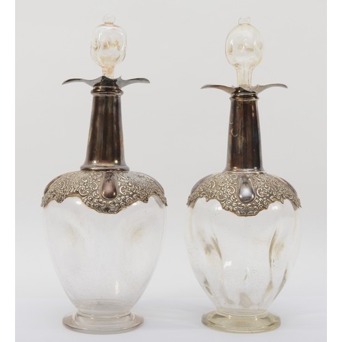 29 - An Edwardian silver mounted pair of spirit decanters, by William Hutton & Sons Ltd., Birmingham 1901... 