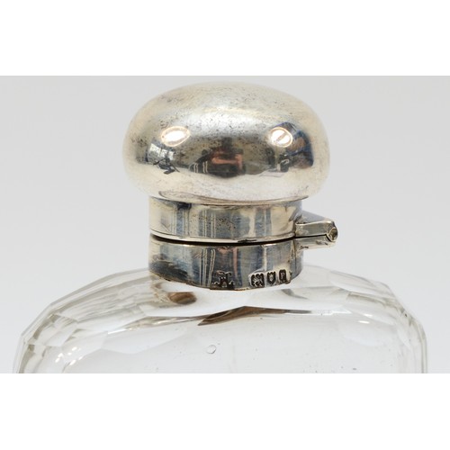 22 - A silver and glass hip flask, by Mappin & Webb, London 1910, with bayonet cap and pull off base, ini... 