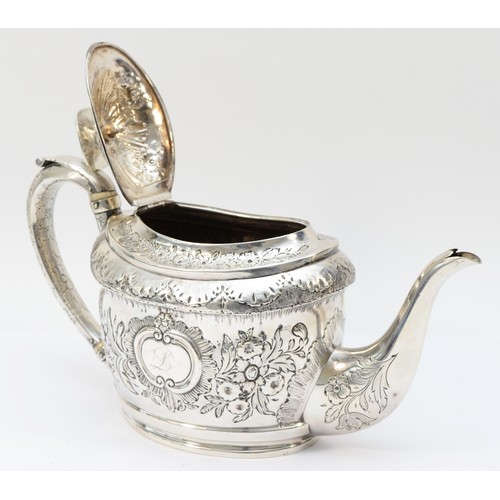 24 - A George III silver tea pot, by John Emes, London 1801, with later embossed and chased decoration, t... 