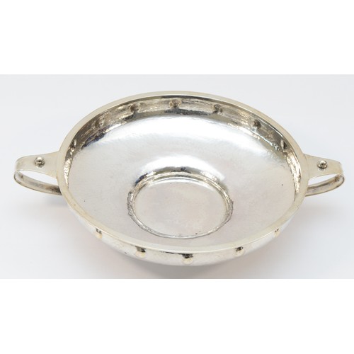 25 - A silver two handled bowl, by A.E. Jones, Birmingham 1918, with hammered and ball decoration, 26.5cm... 