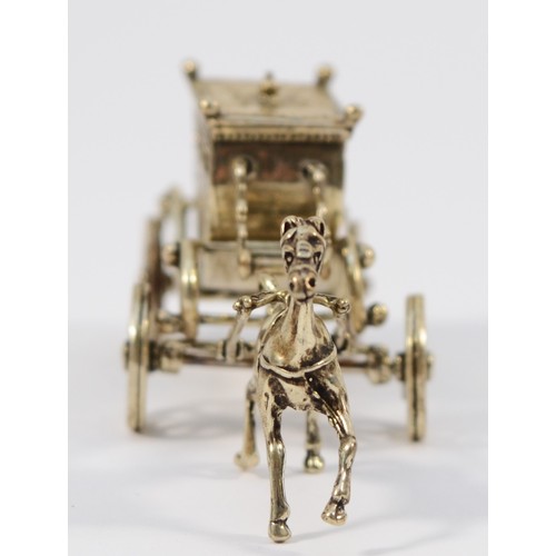 58 - An Italian silver novelty stagecoach, with rotating wheels, 10cm, 50gm