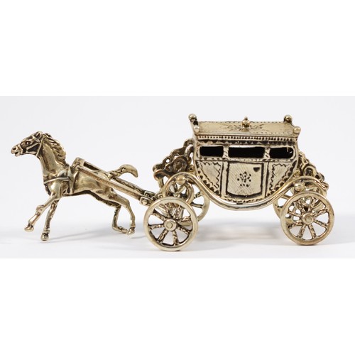 58 - An Italian silver novelty stagecoach, with rotating wheels, 10cm, 50gm