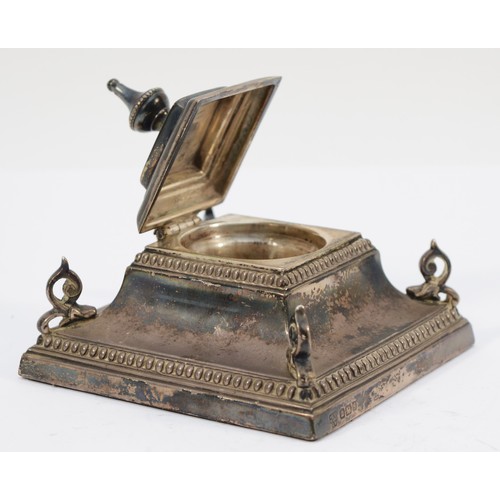 32 - An Edwardian silver inkwell, Sheffield 1910, of square form, with bead border and scroll corners, 9 ... 