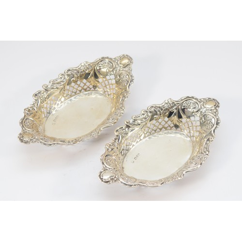 34 - A Victorian silver pair of bon bon dishes, by Nathan & Haynes, Chester 1899, of oval pierced form, 1... 