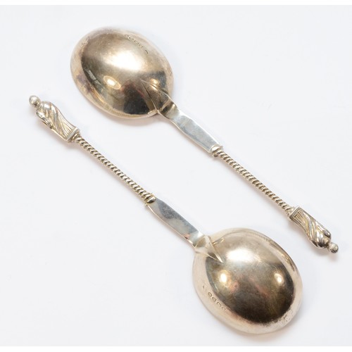 4 - A Victorian silver pair of serving spoons, makers mark poorly struck, London 1881, the cast handles ... 