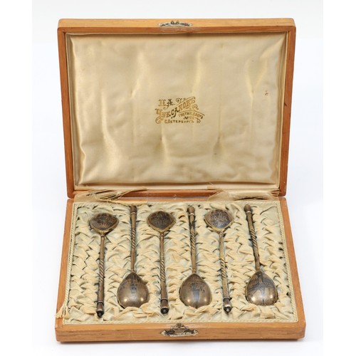 A Russian silver gilt and niello set of six lemon tea spoons, by Stepan Levin, Moscow c.1900, 84 kolkhoznik, decorated with landmark building, original case with brass plaque, monogrammed EEC, February 10th 1903, St. Petersburg, 75gm