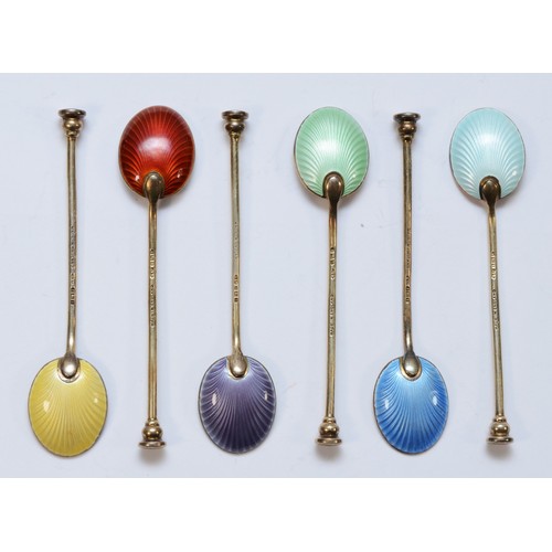 8 - A silver gilt and enamel set of seal top coffee spoons, Birmingham 1955/6, with guilloche enamel bow... 