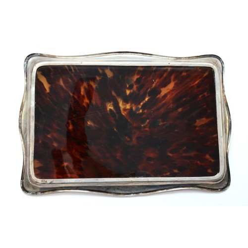 45 - A Victorian silver and tortoiseshell dressing table tray, London 1896, with fruit, bird and scroll i... 