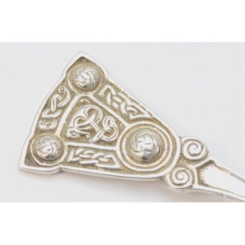 12 - A Scottish silver Celtic caddy spoon, by A.L, Edinburgh 1949, untraced, with cast handle, 11.5cm, 28... 