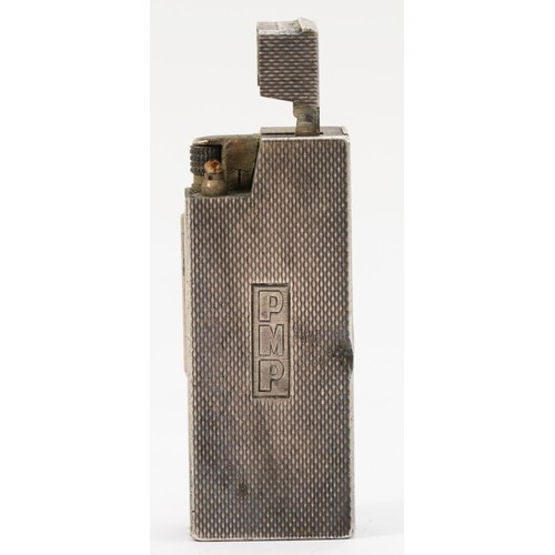 81 - Dunhill, an unusual silver petrol lighter, by Alfred Dunhill & Sons, Birmingham 1975, with engine tu... 