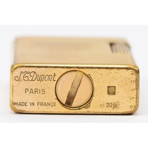 84 - S.T. Dupont, Paris, a gold plated gas lighter, N5156, with ribbed body, 4.6cm