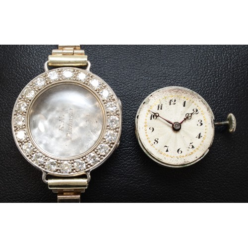 106 - A platinum and diamond maual wind ladies wristwatch, c.1930's, silvered dial with Arabic numerals, u... 