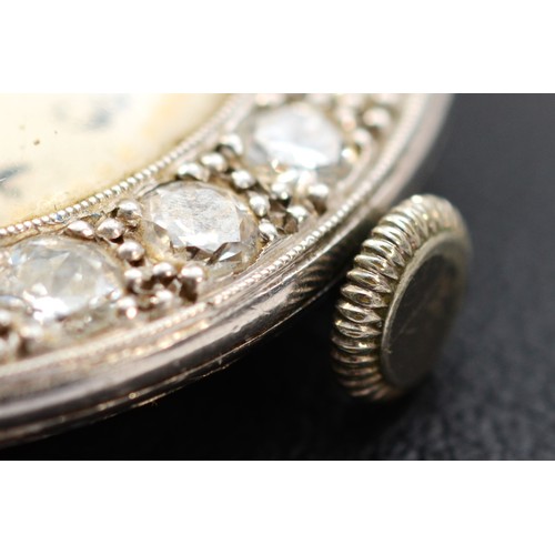 106 - A platinum and diamond maual wind ladies wristwatch, c.1930's, silvered dial with Arabic numerals, u... 