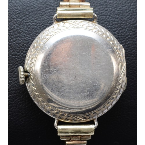 106 - A platinum and diamond maual wind ladies wristwatch, c.1930's, silvered dial with Arabic numerals, u... 