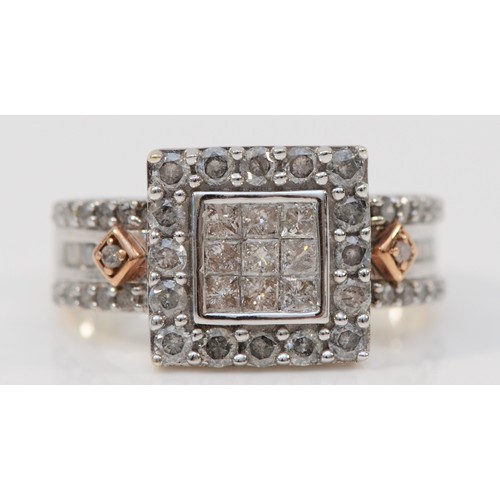 117 - A 9ct white gold and diamond square cluster ring, set with Princess cut stones bordered by brilliant... 