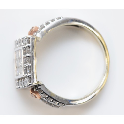 117 - A 9ct white gold and diamond square cluster ring, set with Princess cut stones bordered by brilliant... 