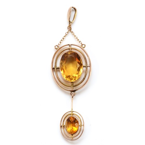 124 - An Edwardian 9ct rose gold and citrine pendant, the main stone 16 x 11mm, overal length 70mm, 6.5gm