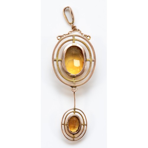 124 - An Edwardian 9ct rose gold and citrine pendant, the main stone 16 x 11mm, overal length 70mm, 6.5gm