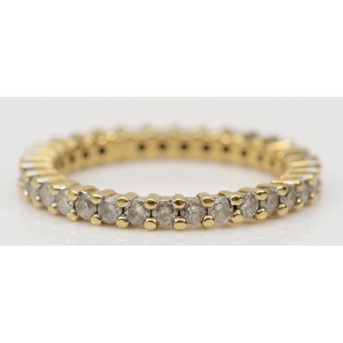 125 - A 9ct gold and brilliant cut diaond full eternity ring, 34 stones, approximately 0.70cts total, O, 2... 