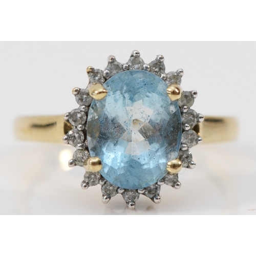 131 - A 9ct gold aquamarine and brilliant cut diamond cluster ring, stone 10 x 8mm, O, 3.2gm