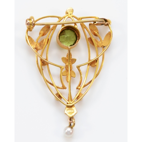 132 - An Edwardian 9ct gold, peridot and half pearl openwork brooch, 38 x 26mm, 3.4gm