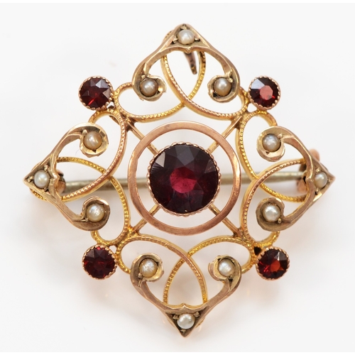 137 - An Edwardian 9ct rose gold milligrain collet set garnet and half pearl brooch pendant, lacking bail,... 