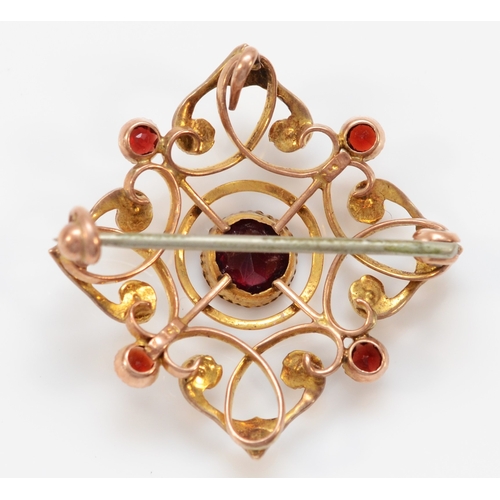 137 - An Edwardian 9ct rose gold milligrain collet set garnet and half pearl brooch pendant, lacking bail,... 