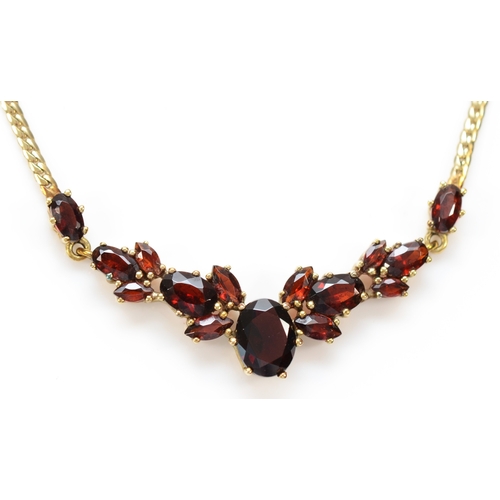 138 - A 9ct gold and graduated garnet panel front necklace, 48mm, to a flattened curb link chain42cm, 6.4g... 