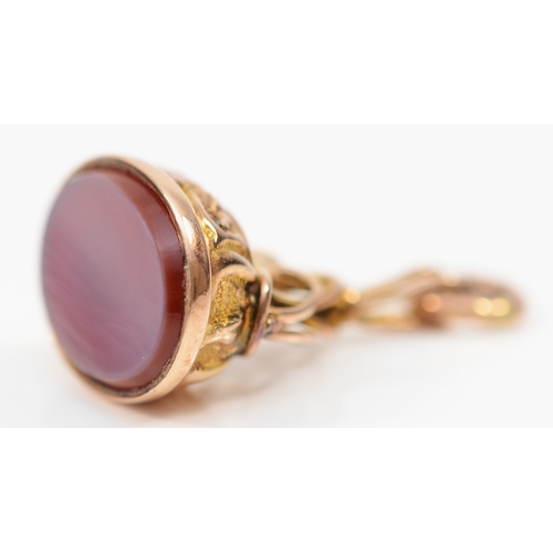 142 - A rose gold and banded agate seal, Chester 1914, with scroll surmount25mm, 4.7gm