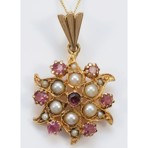 145 - An unmarked Victorian style rose gold pink tourmaline and half pearl pendant, diameter19mm, chain, 2... 