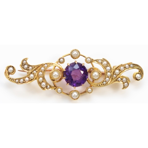 148 - An unmarked Victorian gold amethyst and half pearl scroll brooch, tests 9ct, 41mm, 4.1gm