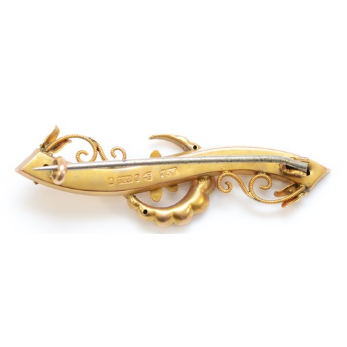 155 - A Victorian 9ct gold red paste and half pearl crescent and scroll brooch, Chester 1898, 45mm, metal ... 