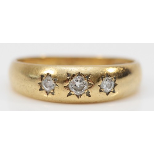 158 - A 9ct gold Edwardian style three stone diamond ring, star gypsy set with brilliant cut stones, O, 2.... 