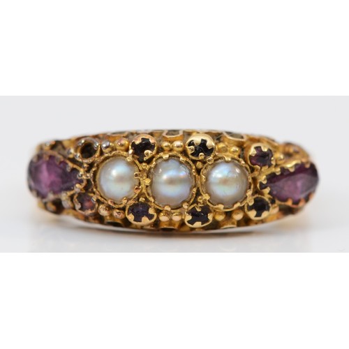 177 - A Victorian 18ct gold amethyst and pearl ring, London 1860, with scroll mount and floral engraved sh... 