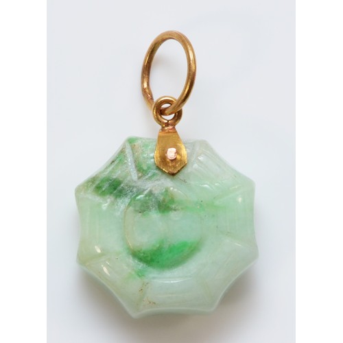 178 - A Chinese gold mounted jadeite Jin/Jan pendant, bordered by a spiders web, diameter 15mm