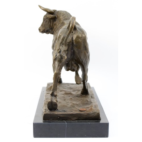 185 - A large bronze model of a Bull, signed 'Milo' later casting with foundry mark, upon a rectangular po... 