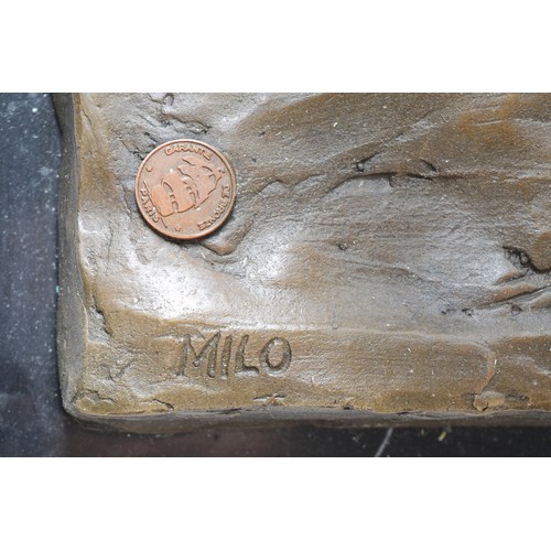 185 - A large bronze model of a Bull, signed 'Milo' later casting with foundry mark, upon a rectangular po... 