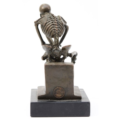 189 - A bronze figural model of a seated skeleton, signed 'Milo' later casting, with foundry stamp, upon a... 