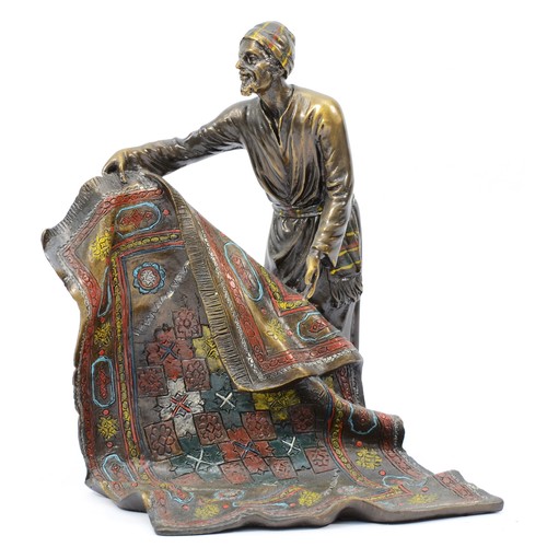 190 - A cold painted bronze model of an Arab carpet seller, signed 'Bergman' later casting, with foundry s... 