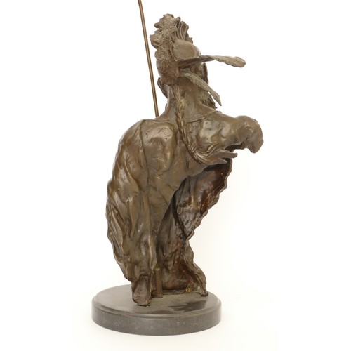 191 - A large bronze bust of a native American Indian Chief holding an arrow, signed 'Nick', raised on a c... 