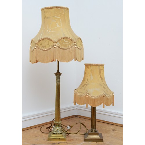 202 - A tall gilt brass table lamp, in the form of Corinthian column on a stepped base, with tassel fabric... 