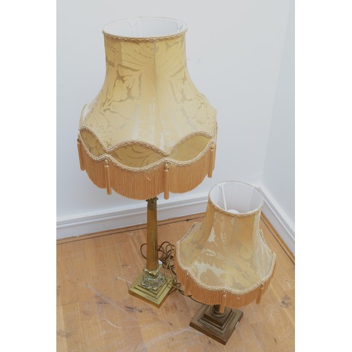 202 - A tall gilt brass table lamp, in the form of Corinthian column on a stepped base, with tassel fabric... 